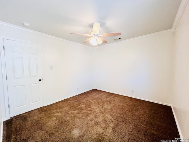 carpeted spare room featuring ceiling fan and ornamental molding