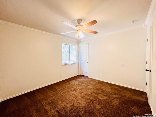 carpeted empty room with ceiling fan and ornamental molding