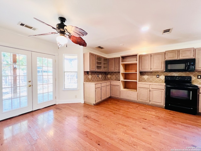 kitchen featuring french doors, light wood-type flooring, tasteful backsplash, ornamental molding, and black appliances