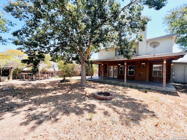 view of yard with an outdoor fire pit