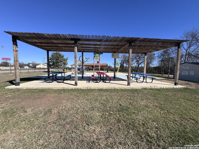 view of home's community with a pergola and a yard