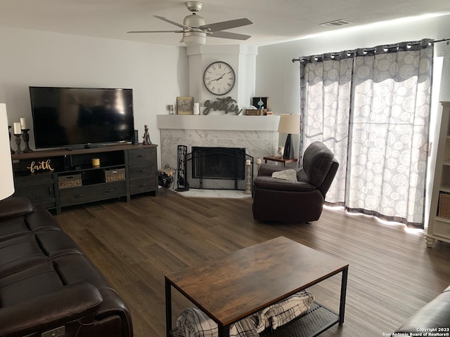 living room with hardwood / wood-style floors and ceiling fan