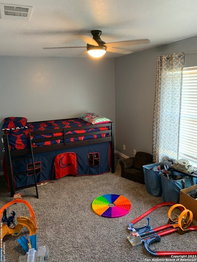 carpeted bedroom featuring ceiling fan