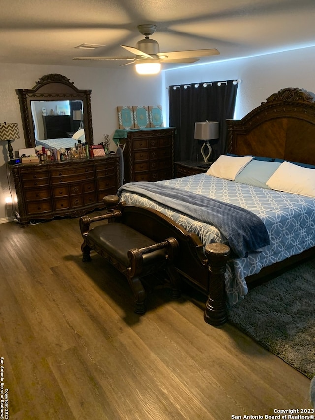 bedroom featuring hardwood / wood-style floors and ceiling fan