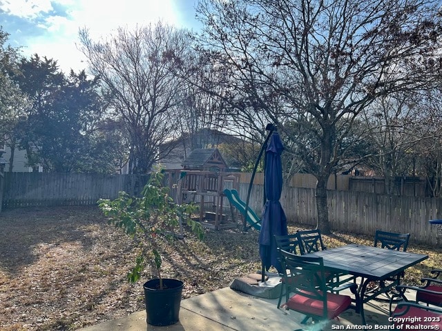 view of yard with a playground