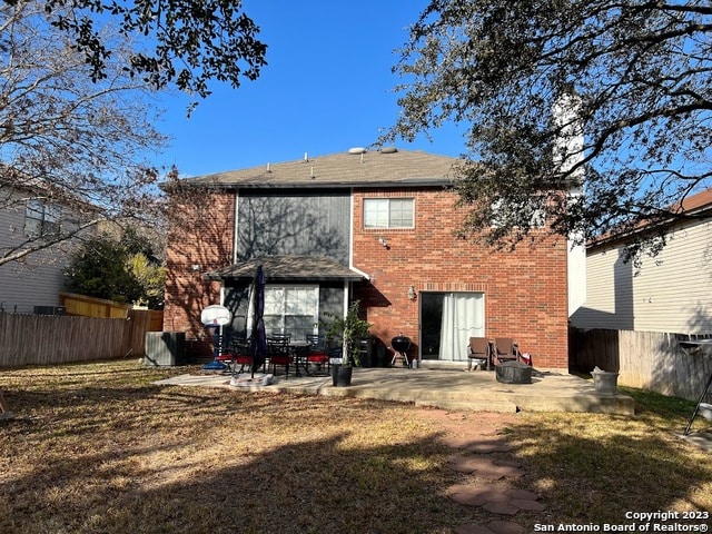 back of property featuring a patio area