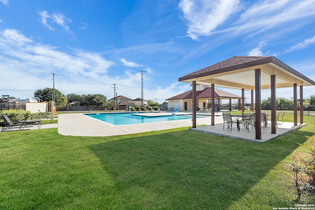 view of swimming pool featuring a lawn, a gazebo, and a patio area