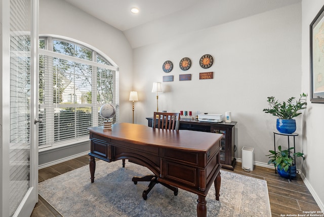 office featuring dark hardwood / wood-style flooring and lofted ceiling