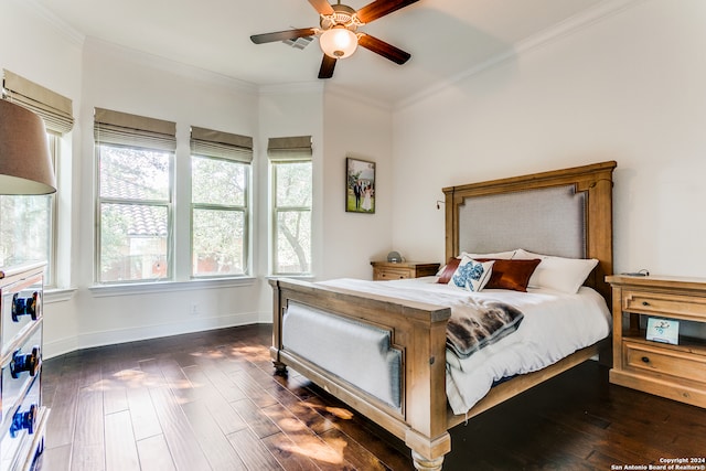 bedroom with dark hardwood / wood-style floors, ceiling fan, and ornamental molding