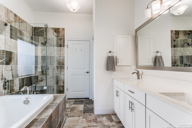 bathroom with vanity and independent shower and bath