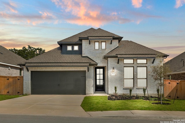 2612 Sueno Pt, San Antonio, TX 78245 - french country inspired facade featuring driveway, an attached garage, roof with shingles, and brick siding