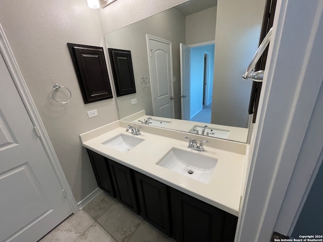 bathroom featuring tile patterned floors and vanity