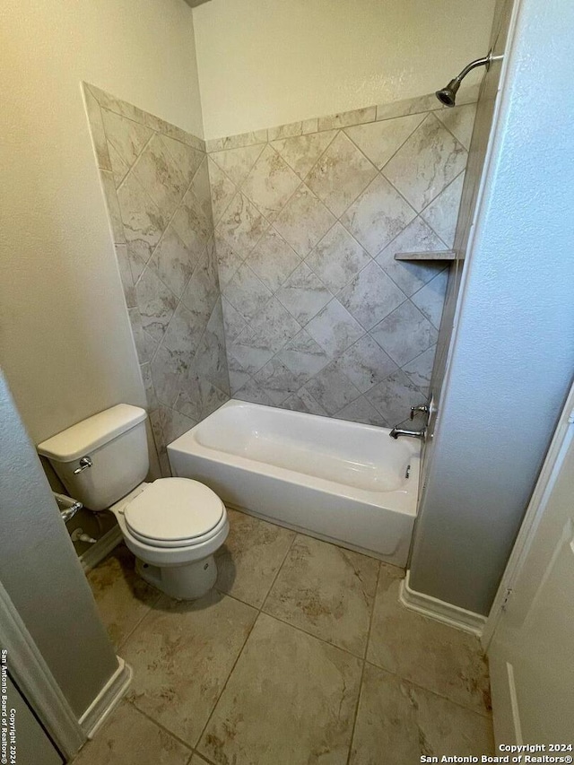 bathroom featuring tile patterned flooring, toilet, and shower / bath combination