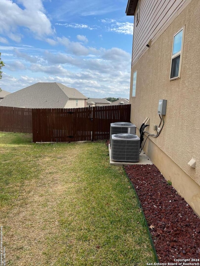 view of yard with central air condition unit