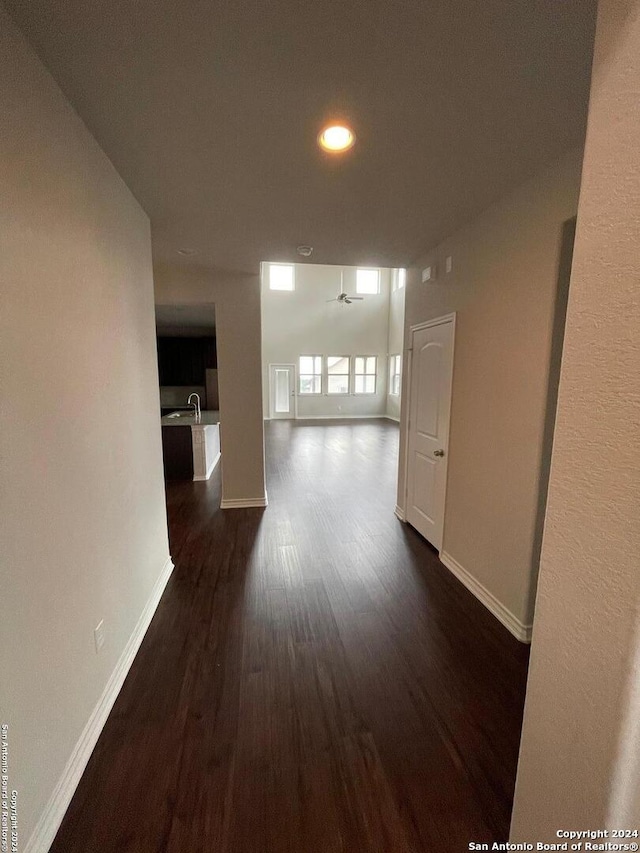 hallway with sink and dark hardwood / wood-style floors