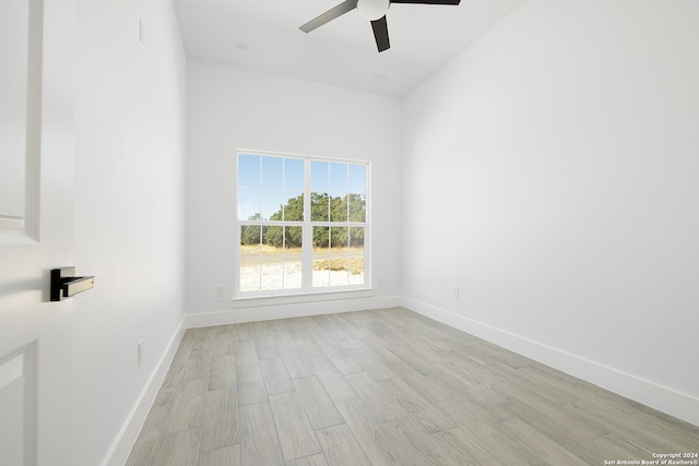 unfurnished room with light wood-type flooring and ceiling fan