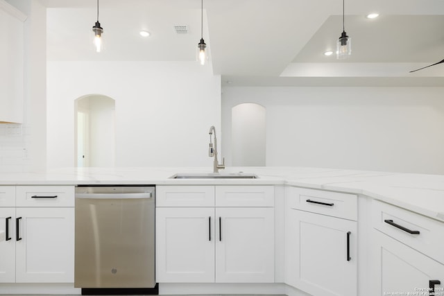 kitchen with white cabinets, dishwasher, light stone countertops, and sink