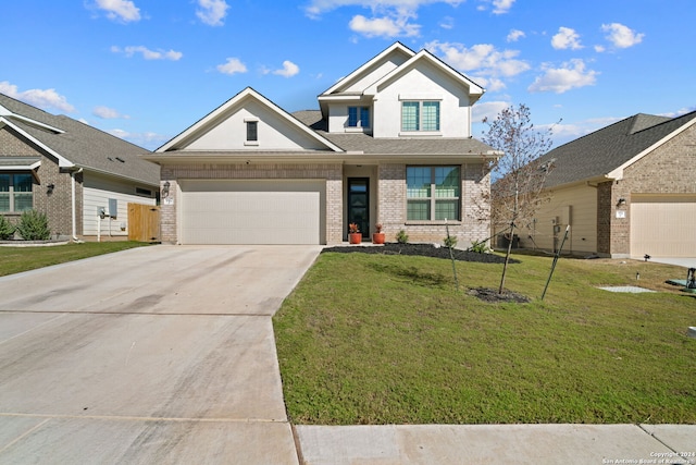 view of front facade with a front yard and a garage