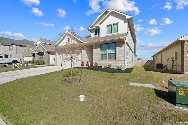 view of front facade with cooling unit, a garage, and a front yard