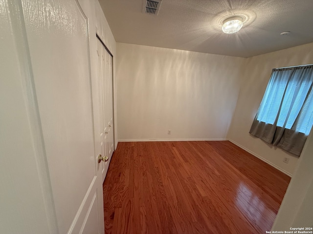 unfurnished bedroom featuring wood-type flooring