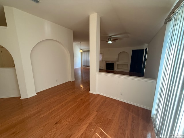 empty room featuring wood-type flooring and ceiling fan