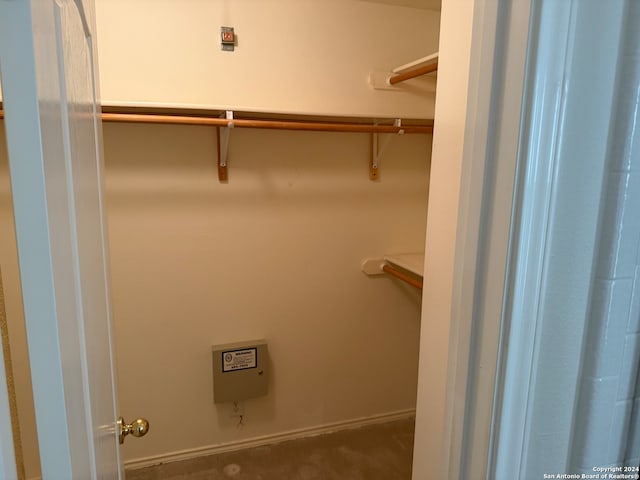 spacious closet with carpet floors