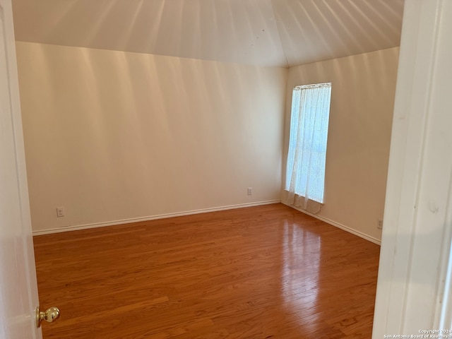 unfurnished room featuring hardwood / wood-style floors