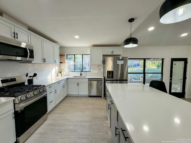728 Rittiman, Terrell Hills, TX 78209 - kitchen with appliances with stainless steel finishes, a sink, decorative backsplash, light countertops, and recessed lighting