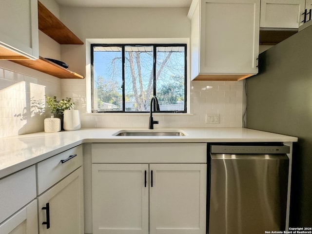 728 Rittiman, Terrell Hills, TX 78209 - kitchen featuring dishwasher, a sink, open shelves, decorative backsplash, and white cabinetry