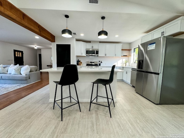 728 Rittiman, Terrell Hills, TX 78209 - kitchen with appliances with stainless steel finishes, a sink, open shelves, a kitchen bar, and light countertops