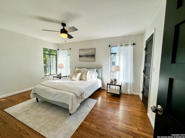 728 Rittiman, Terrell Hills, TX 78209 - bedroom with multiple windows, wood finished floors, baseboards, and a ceiling fan