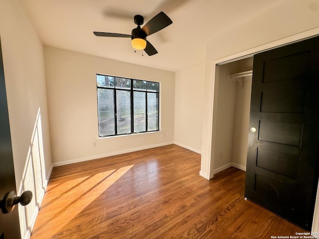 728 Rittiman, Terrell Hills, TX 78209 - unfurnished bedroom with wood finished floors, baseboards, and a ceiling fan