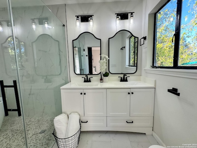728 Rittiman, Terrell Hills, TX 78209 - bathroom featuring marble look tiles, a marble finish shower, baseboards, and double vanity