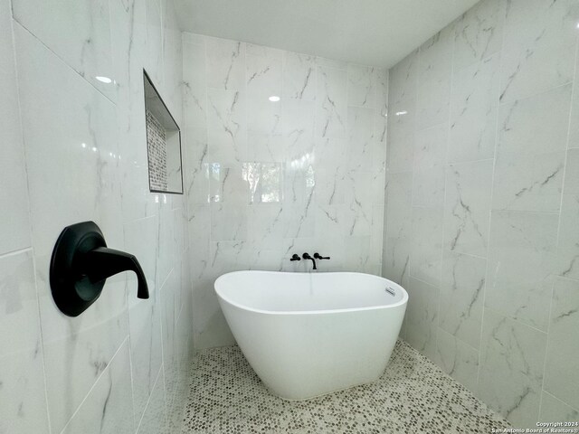 728 Rittiman, Terrell Hills, TX 78209 - bathroom with tile walls and a freestanding tub
