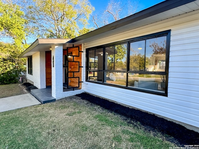 view of property exterior featuring a yard