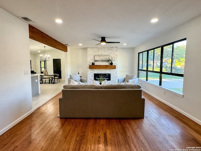 728 Rittiman, Terrell Hills, TX 78209 - living area featuring baseboards, recessed lighting, a stone fireplace, wood finished floors, and beam ceiling