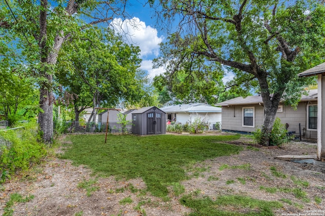 view of yard with a storage unit