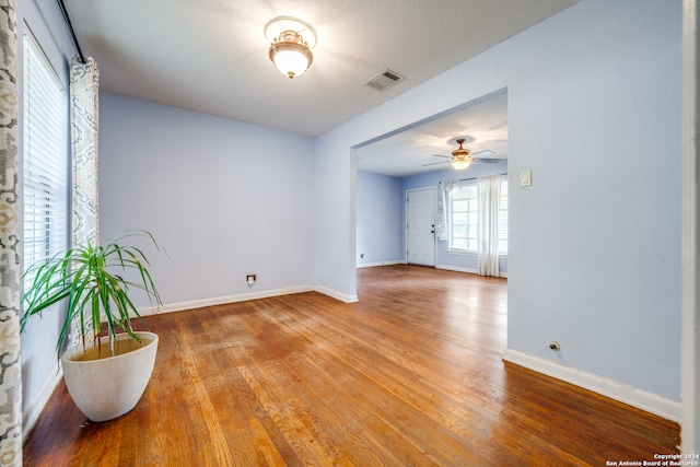 spare room featuring hardwood / wood-style flooring and ceiling fan