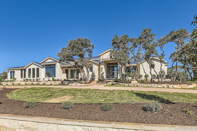 view of front of house with a front lawn