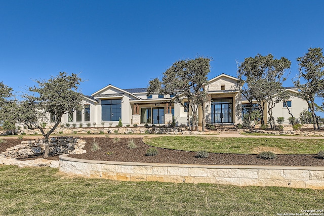 view of front of home featuring a front lawn