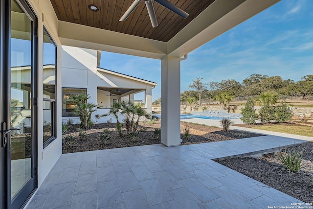 view of patio featuring ceiling fan