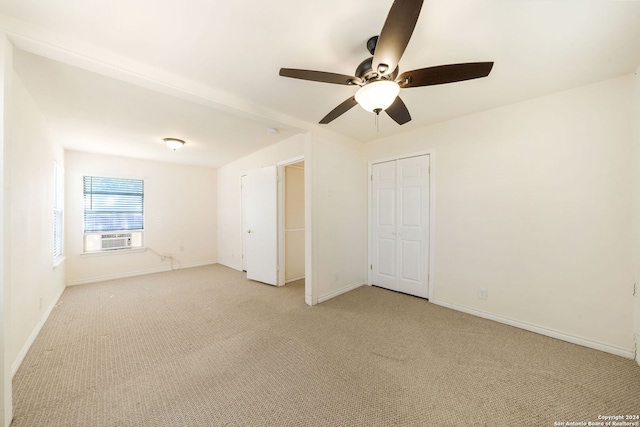 carpeted empty room with ceiling fan and cooling unit