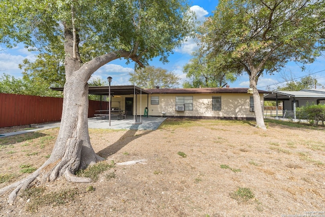 back of property with a patio area