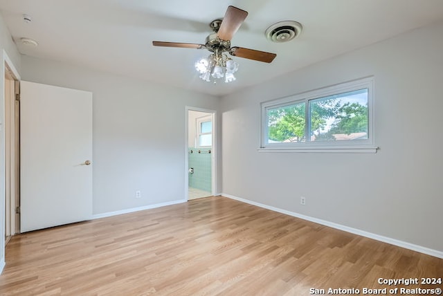 unfurnished bedroom with ceiling fan and light hardwood / wood-style floors