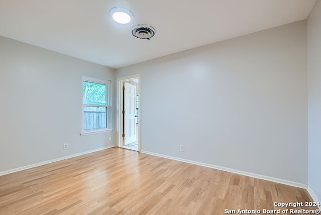 spare room with light hardwood / wood-style floors