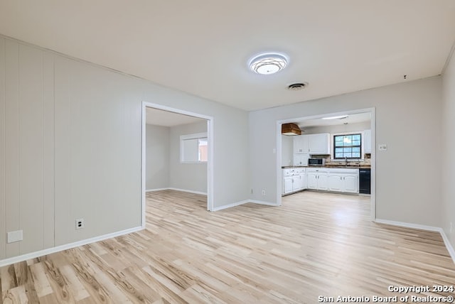 unfurnished living room featuring light hardwood / wood-style floors