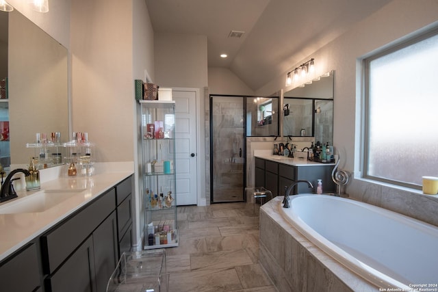 9104 Pepperton Ln, San Antonio, TX 78254 - bathroom with vanity, a bath, lofted ceiling, marble look tiles, and a stall shower