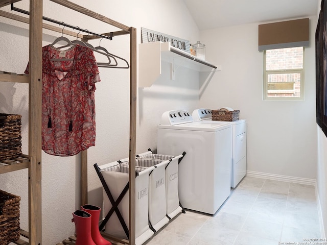 clothes washing area featuring independent washer and dryer