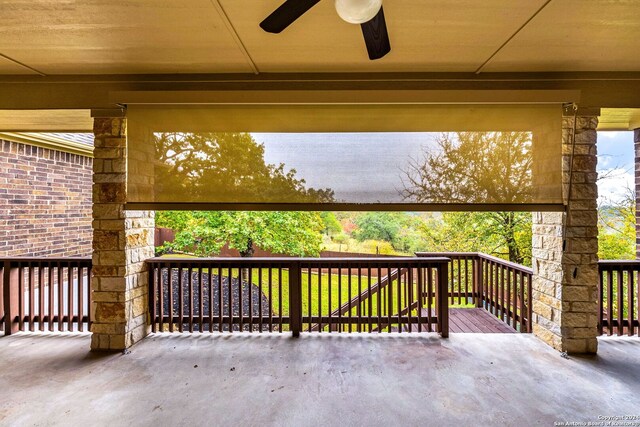 view of patio with a wooden deck and ceiling fan