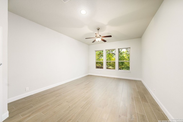 unfurnished room with light hardwood / wood-style floors and ceiling fan